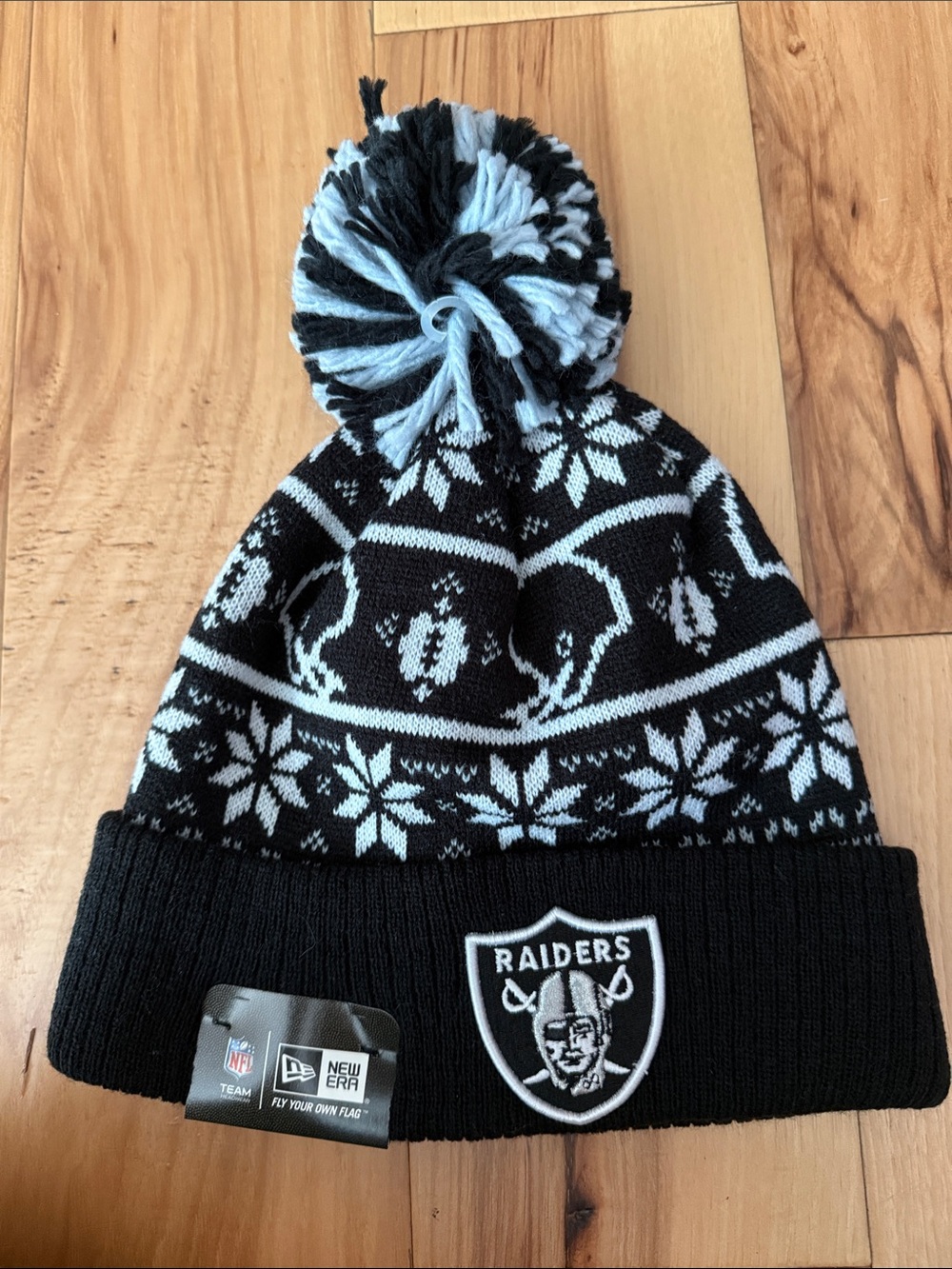 New Era Black and White Raiders Pom Beanie Hat brand new